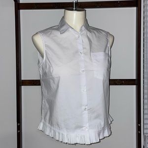 Bright White sleeveless button down blouse with hemline detail.